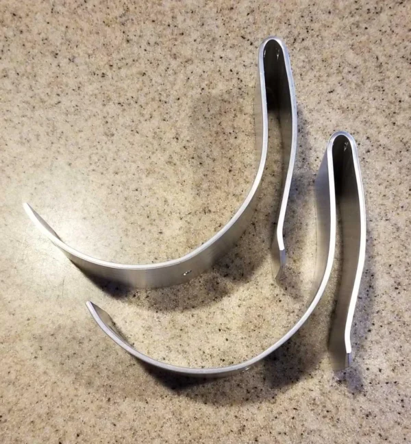 A pair of metal scissors sitting on top of a table.