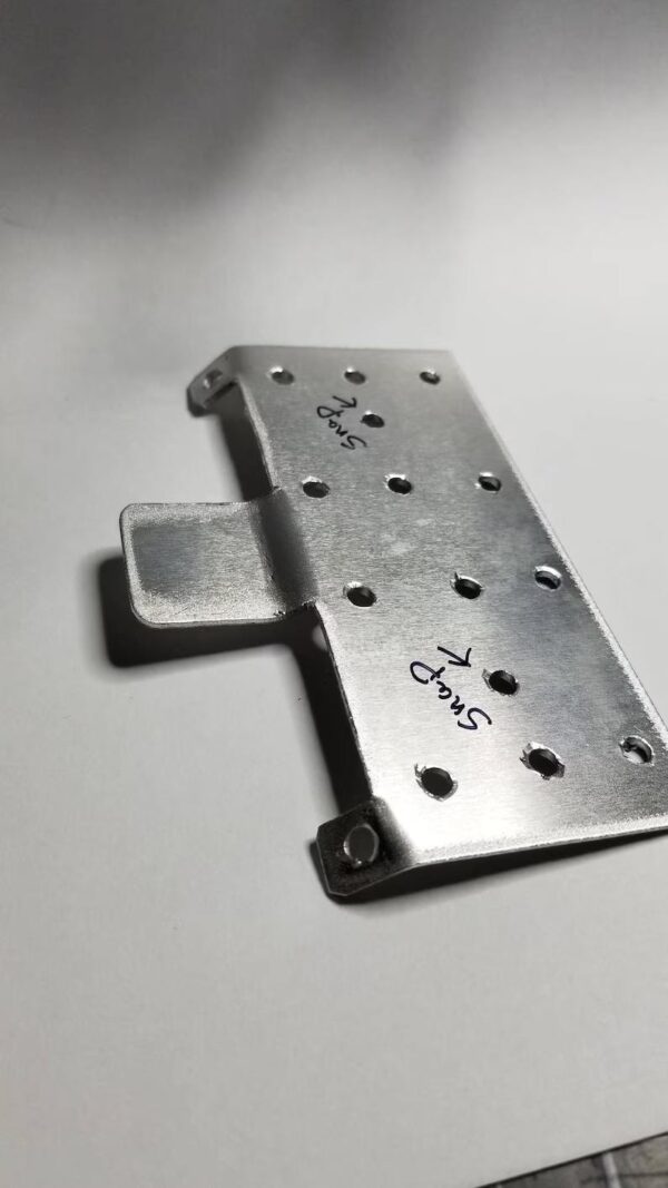 A metal plate with holes on it