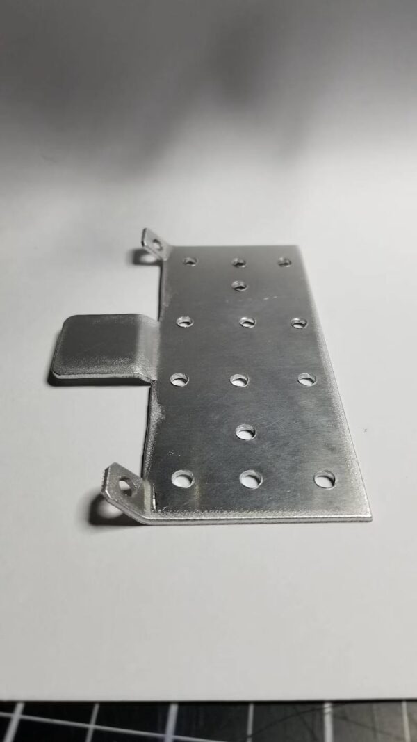 A metal plate with holes on it