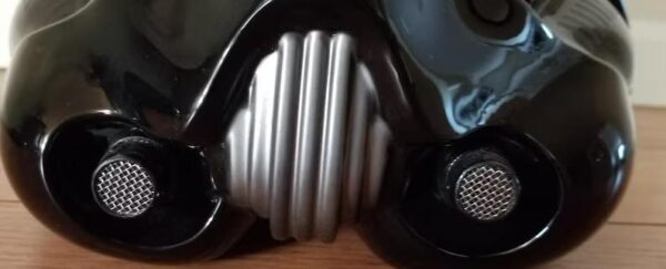 A pair of headphones sitting on top of a wooden table.