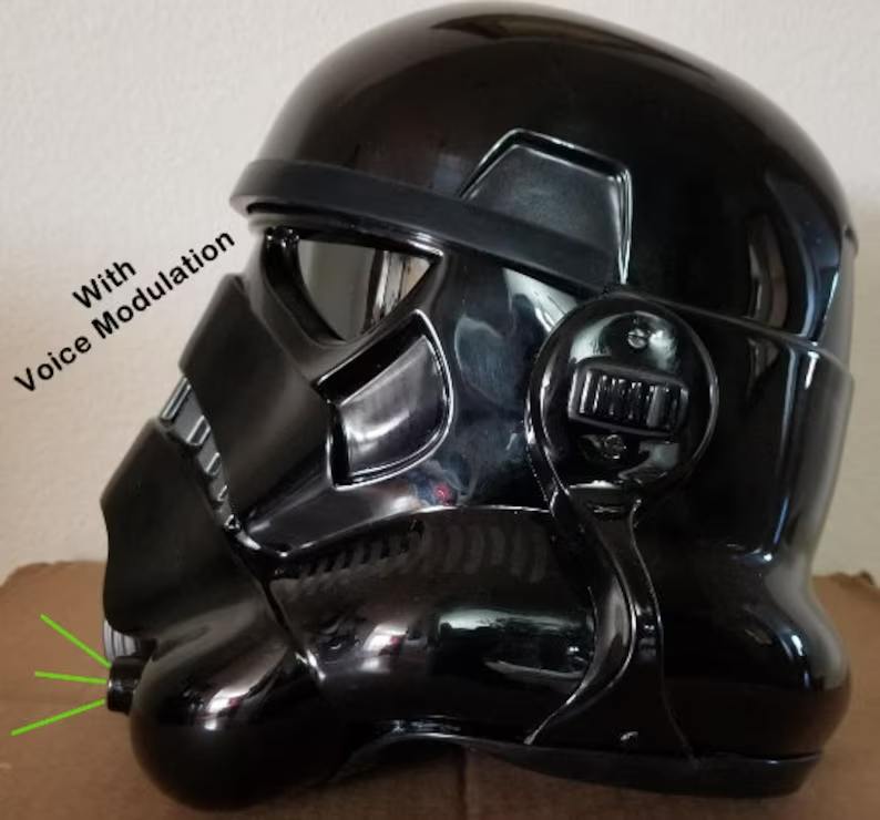 A black helmet with headphones on top of it.