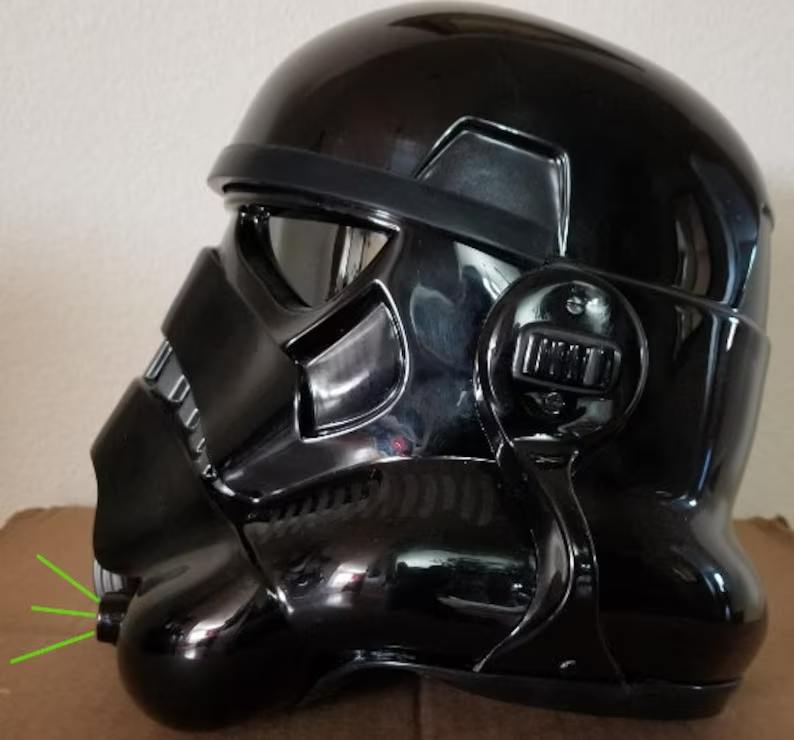 A black helmet with headphones on top of it.