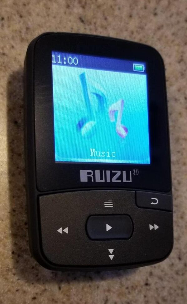 A black ruizu music player sitting on top of a table.