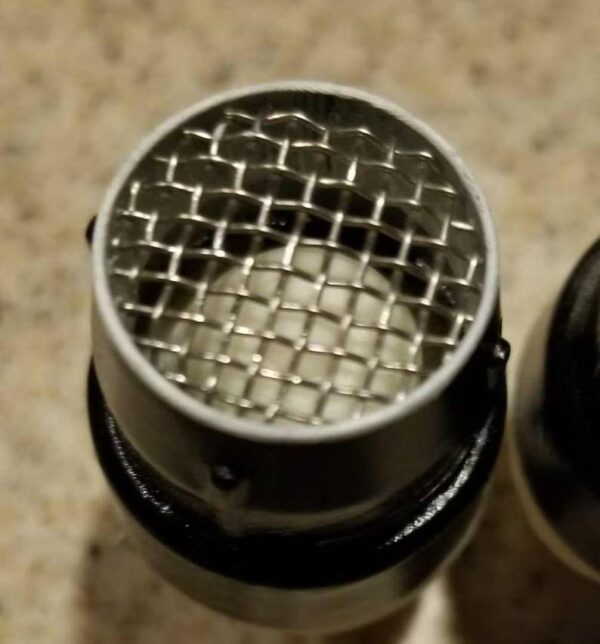 A close up of the top of a microphone