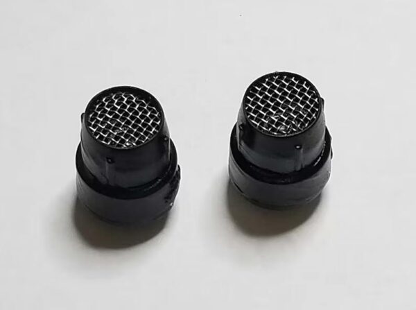 A pair of black knobs with a pattern on them.