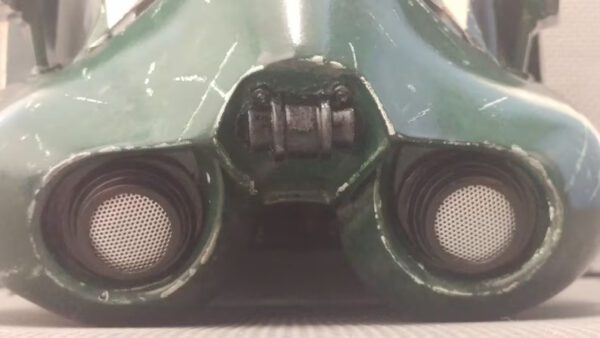 A close up of the speakers on a green helmet