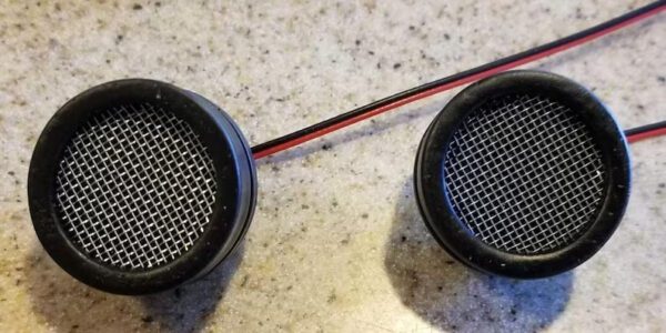 A pair of speakers with wires attached to them.